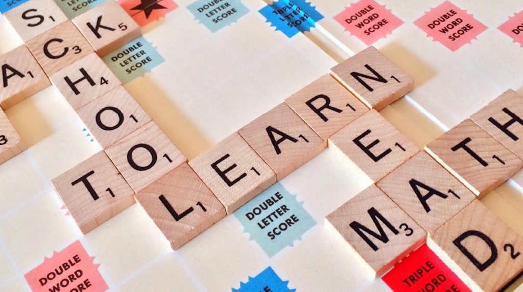 pexels-photo-256417-256417 Close-up of Scrabble tiles forming words related to education and school.